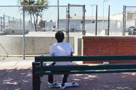 A lone skateboard enthusiast takes a break between rides at the Lemoore skateboard facility